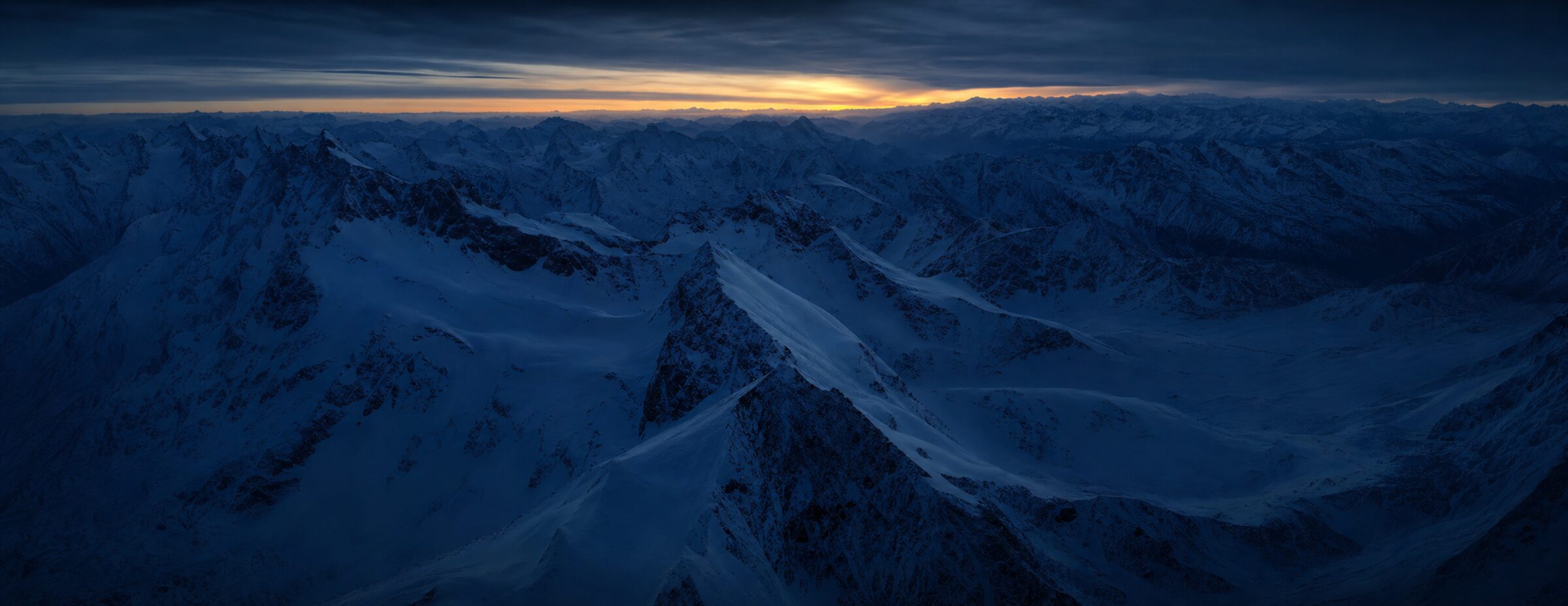 A vast empty alpine massif at blue hour